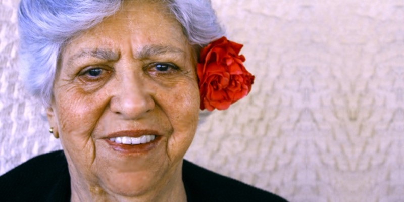 Picture of woman with a red flower in her hair