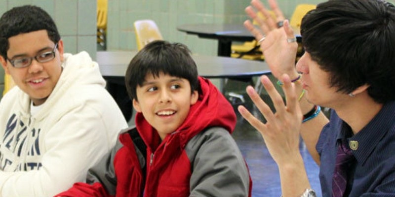 Picture of male teacher with two students