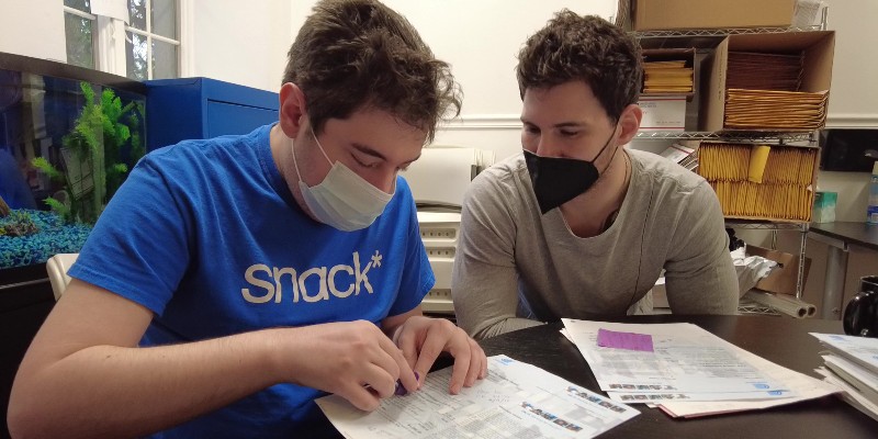 A SNACK participant is helped with an activity