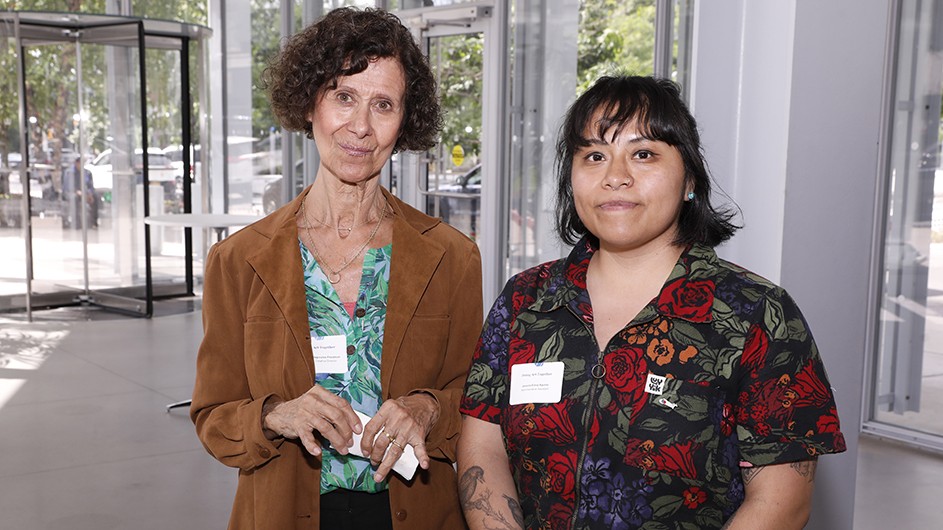 Two grantees pose for a photo. 