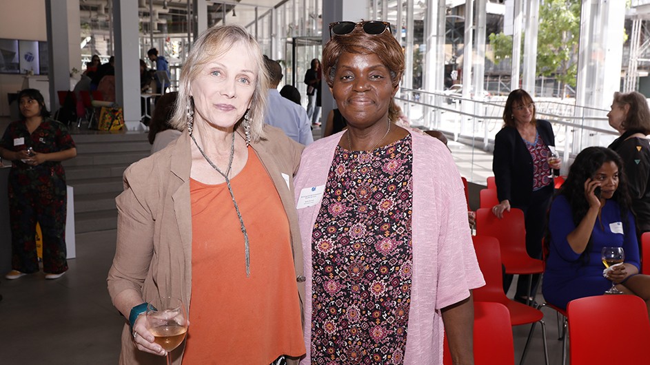 Two grantees pose for a photo.