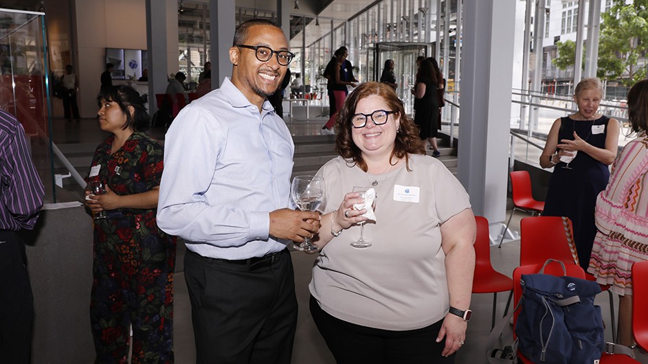 Two grantees pose for a photo. 