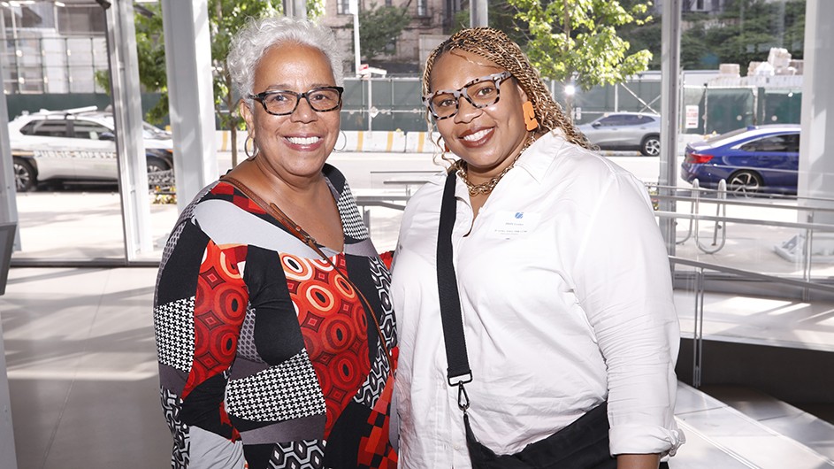 Two grantees pose for a photo. 