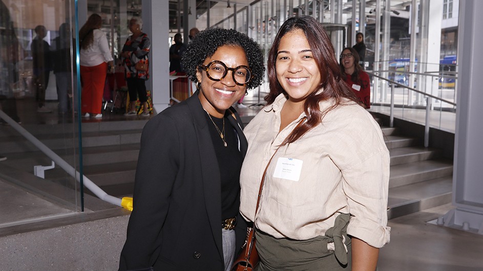 Two grantees pose for a photo. 