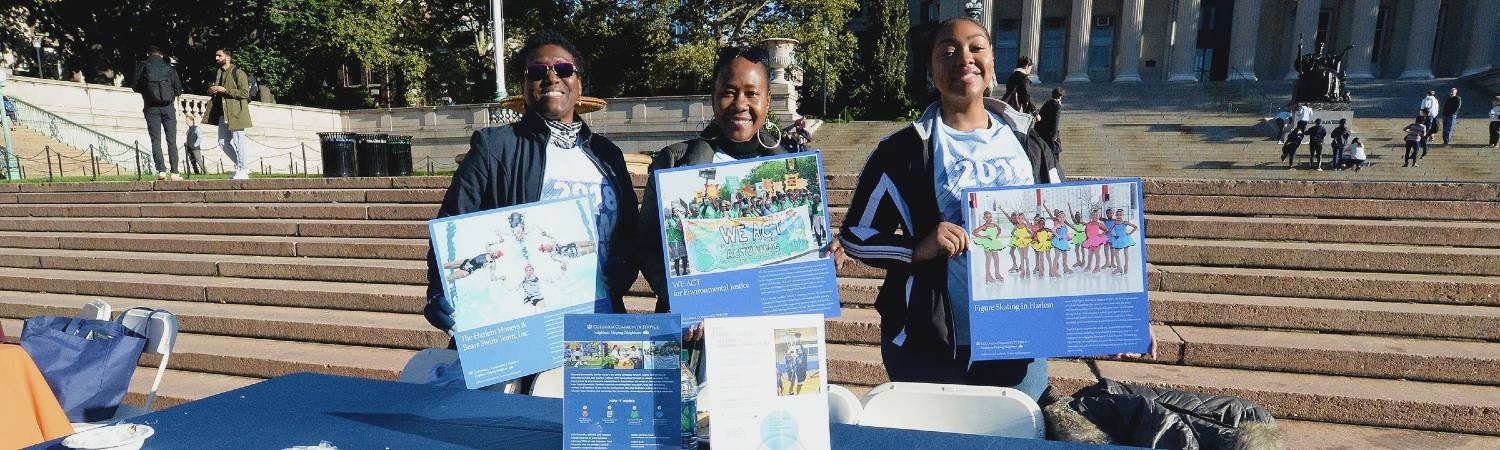 Ambassador Pat Lilly and CCS staff tabling in front of Low Library for the Fun Run