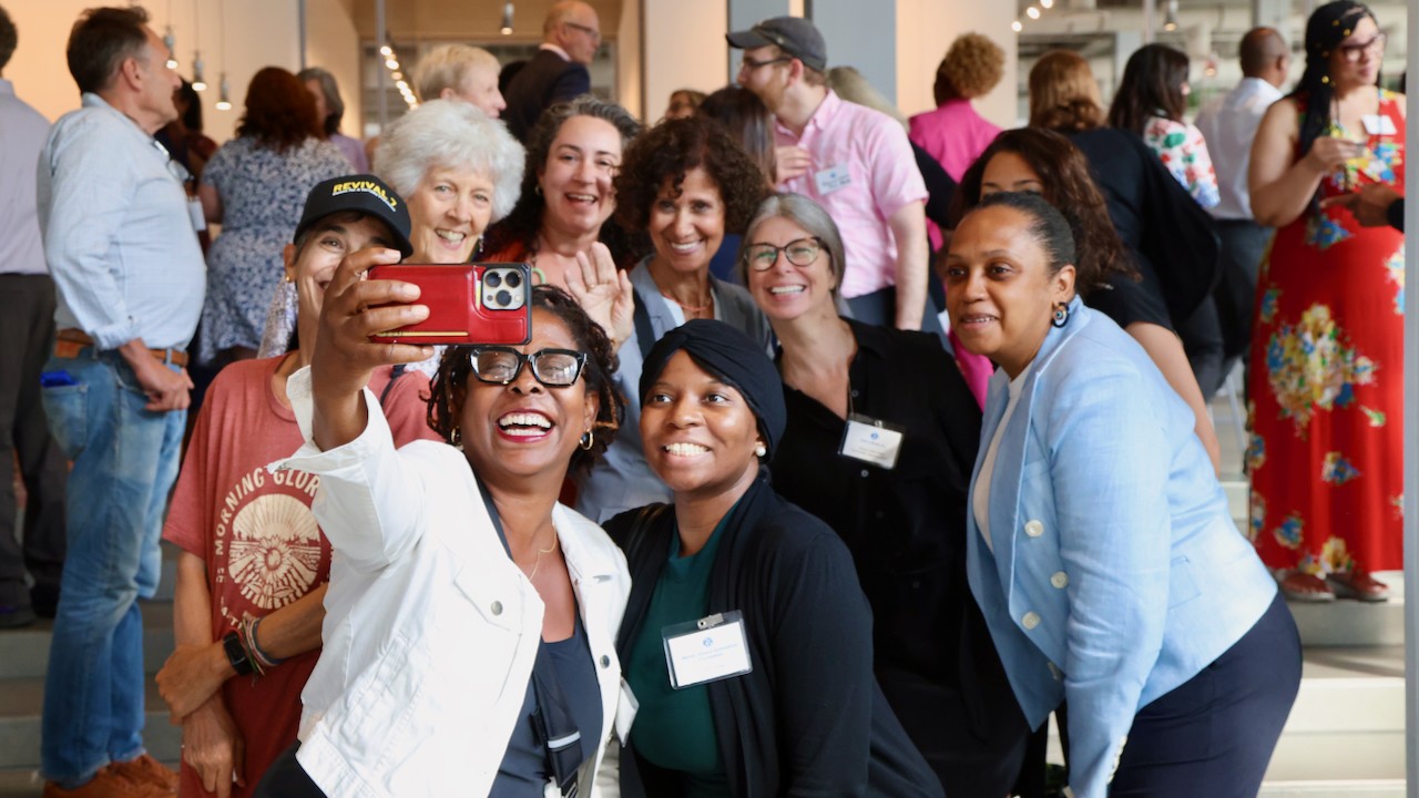 A group of grantees pose for a selfie in the Columbia Forum lobby. Photo by Bruce Gilbert