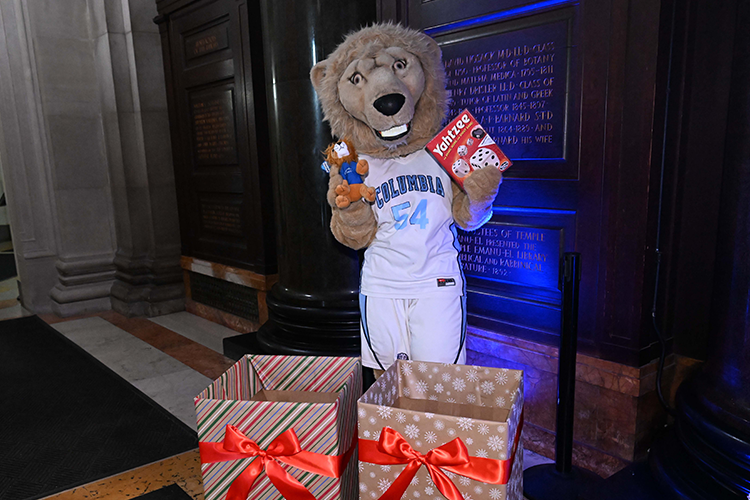Roar-ee donates toys to the 25th Annual Columbia Community Service toy drive. 