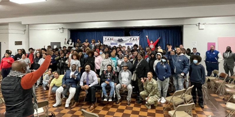 A large group of young people posing for a photo