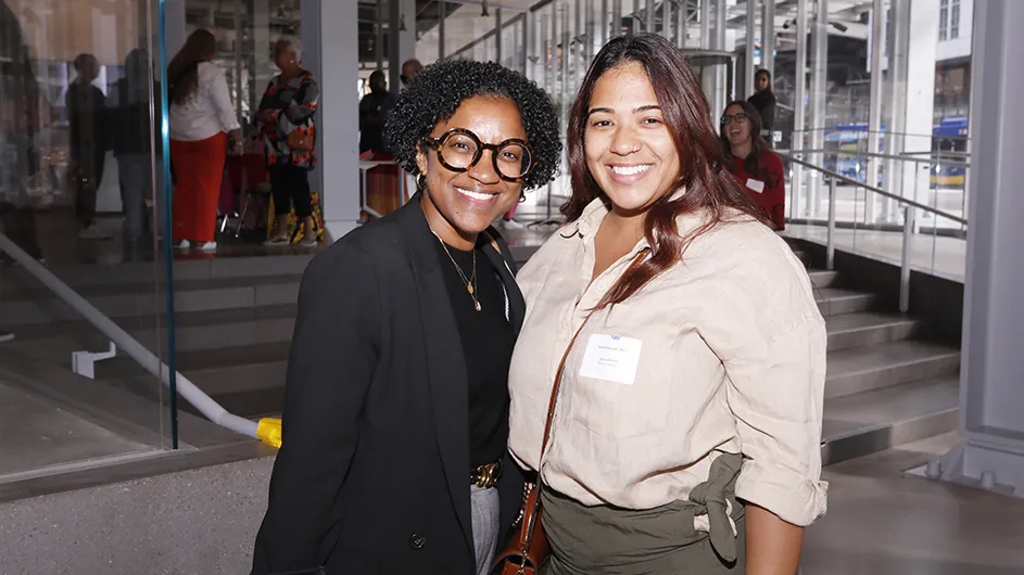 Two grantees pose for a photo. 