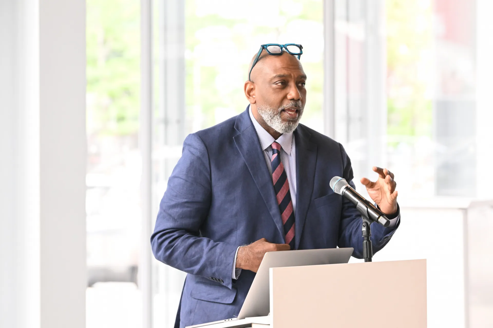 Dr. Basil Smikle Jr. presenting to a crowd of people.