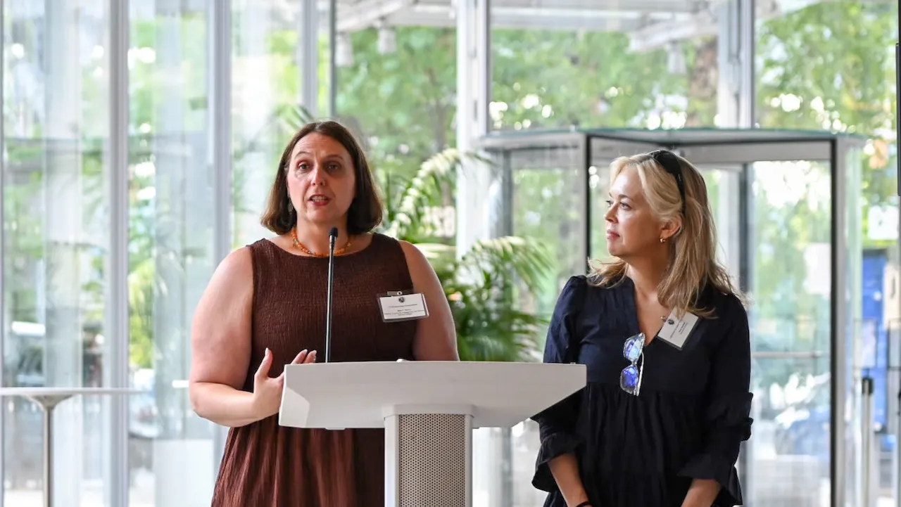 Mary Rocco and Paula Seefeldt address attendees.