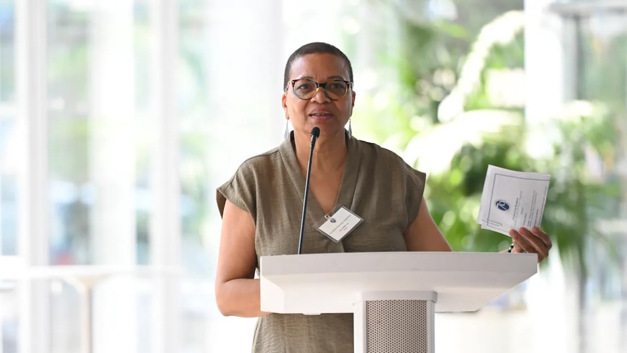 Joan Griffith-Lee addresses attendees.