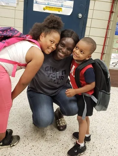 Picture of 2 kids with their new backpacks