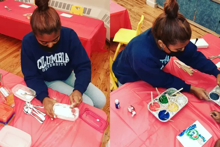 Two images of a young woman in a Columbia sweatshirt. In one she's preparing an activity and in another she's helping a student paint.